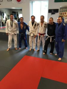 Mitch Dugan standing with his Brazilian jiu-jitsu class.